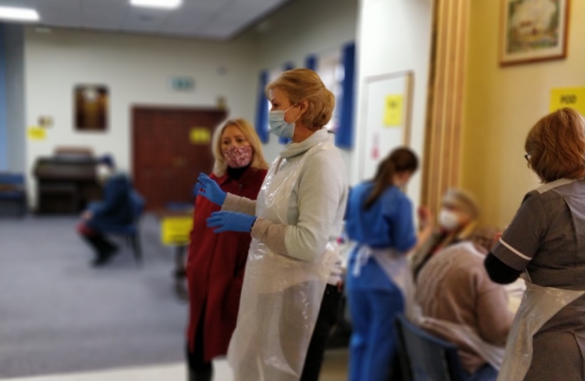 Suzanne Webb MP with a vaccine administrator 