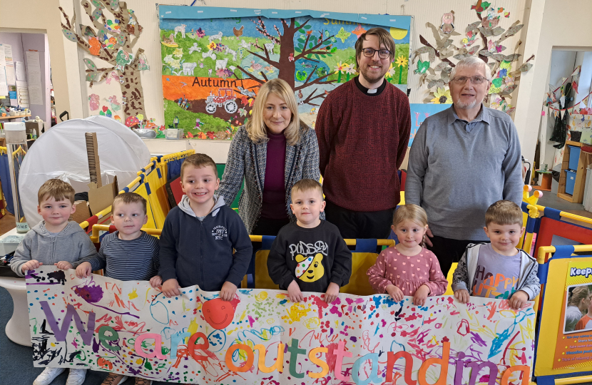 Suzanne with pupils and management