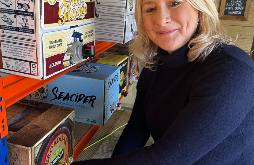 Suzanne pouring cider at the Swan