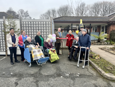 Suzanne Webb MP and Cllr Damian Corfield with Nursing Home residents and staff