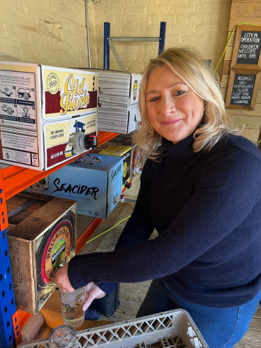 Suzanne pouring cider at the Swan