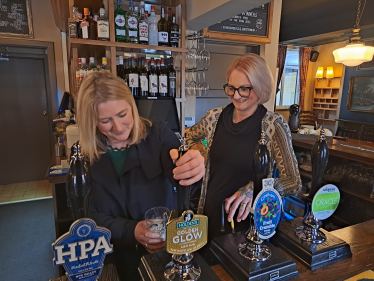 Suzanne Webb MP pulling a pint